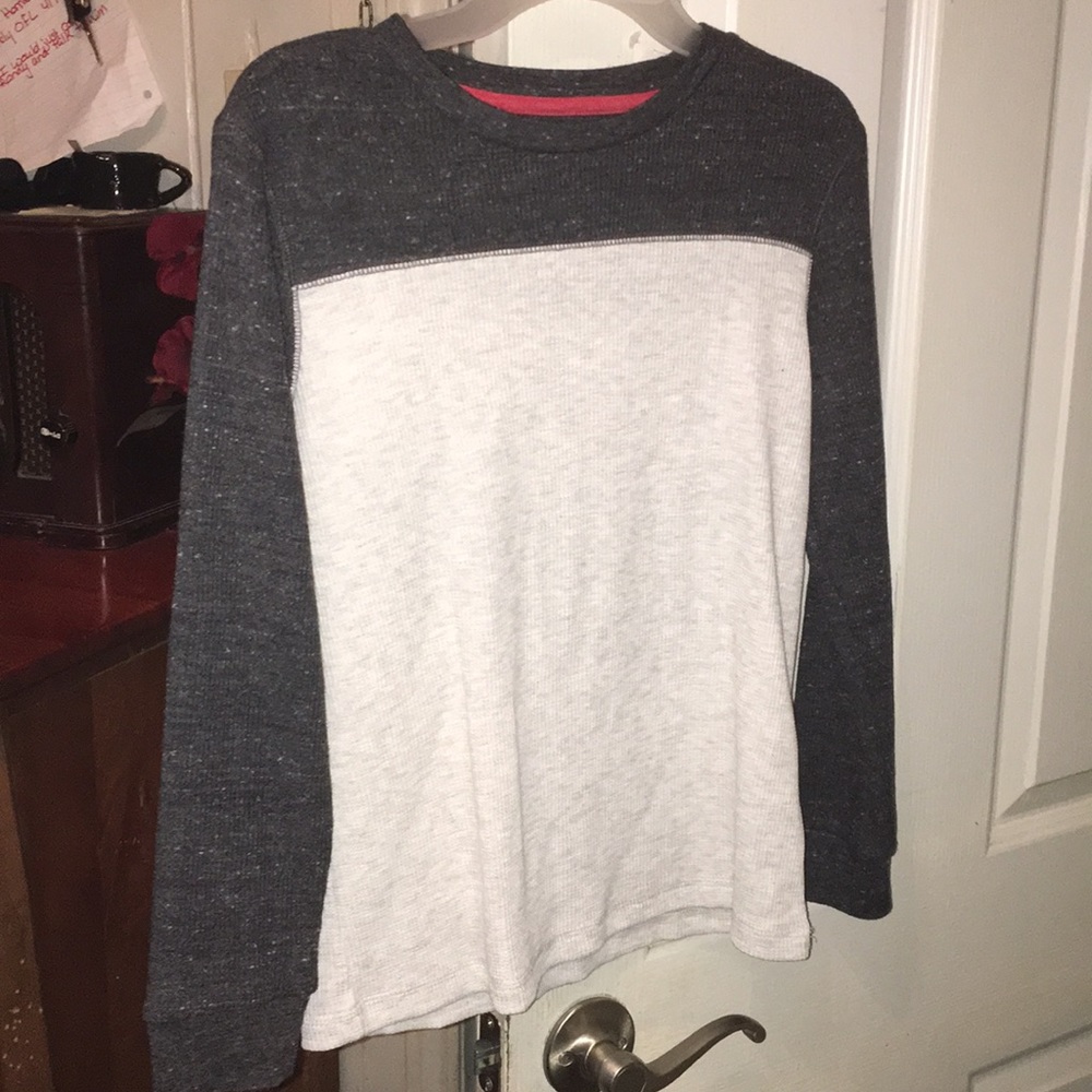A gray and white long sleeve shirt. Kids